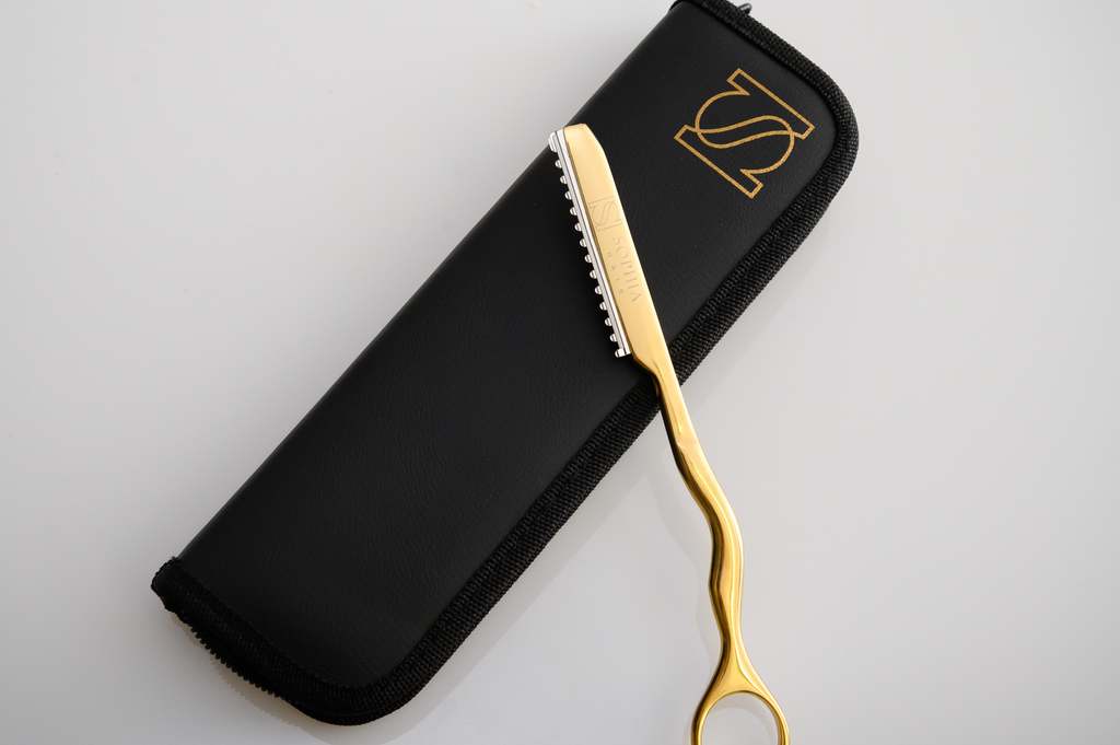 Sophia Hair Extension Gold Razor and case over a white background