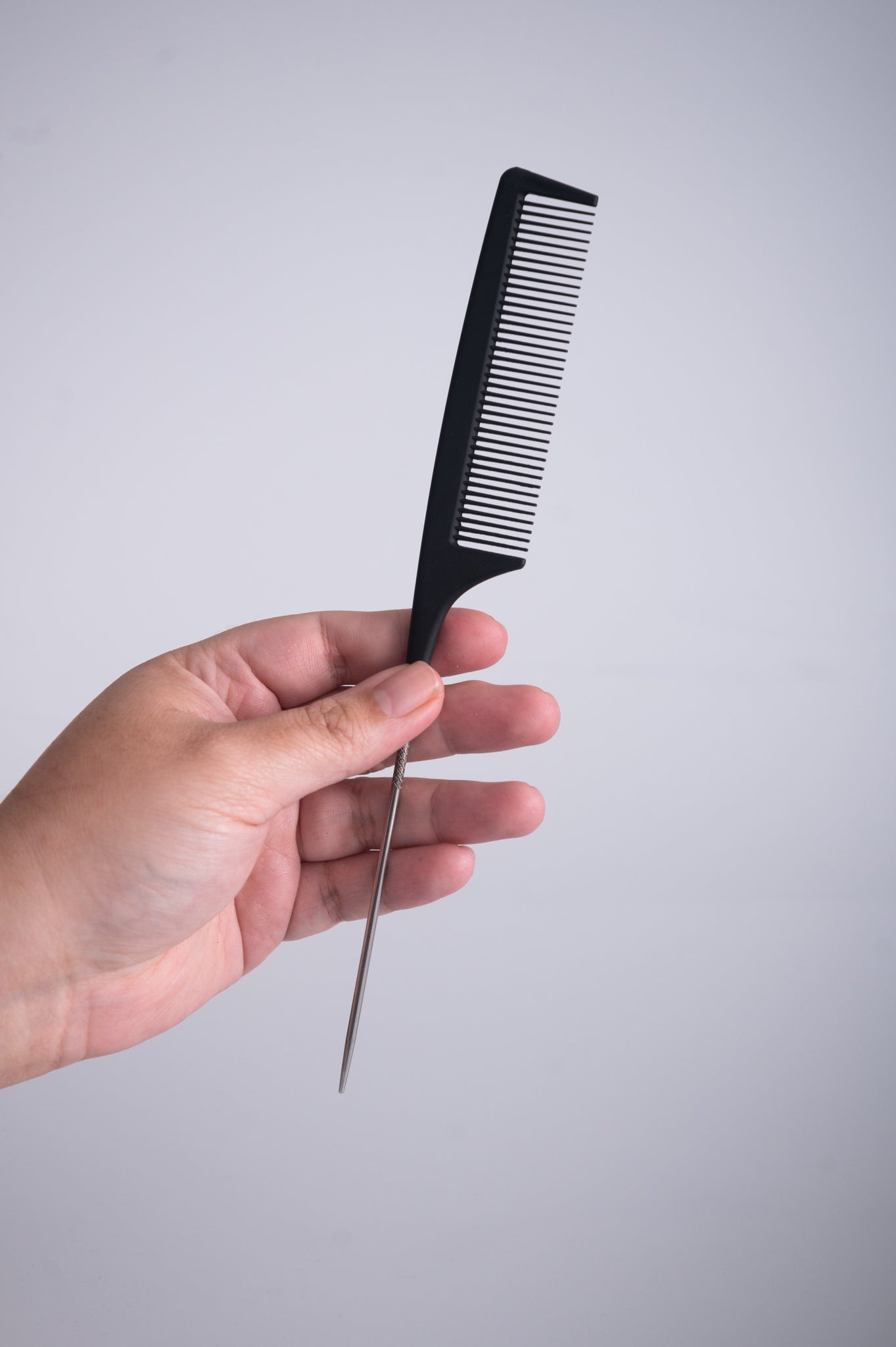 Hair Extension Carbon Tail Comb with a white background